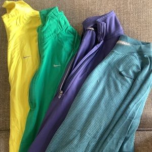 Four Nike workout pullovers